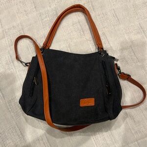 Black, canvas cross body purse.